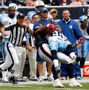 HOUSTON - NOVEMBER 28:  LInebacker Brian Cushing #56 of the Houston Texans throws running back Chris Johnson #28 of the Tennessee Titans out of bounds in the seond quarter at Reliant Stadium on November 28, 2010 in Houston, Texas.  (Photo by Bob Levey/Get