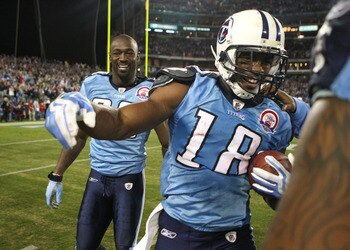 NASHVILLE, TN - NOVEMBER 29:  Kenny Britt #18 of the Tennessee Titans celebrates with teammate Jevon Kearse #90 after catching the game-winning touchdown to give the Titans a 20-17 victory over the Arizona Cardinals during their game at LP Field on Novemb