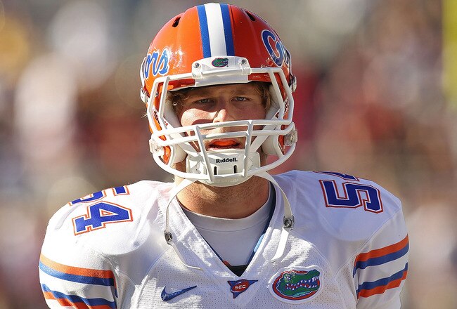 TALLAHASSEE, FL - NOVEMBER 27: Christoper Guido #54  of the Florida Gators warms up before a game against the Florida State Seminoles  at Doak Campbell Stadium on November 27, 2010 in Tallahassee, Florida.  (Photo by Mike Ehrmann/Getty Images)
