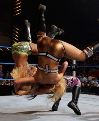 Survivor Series 2010: Natalya defeated Layla and MIchelle McCool in a 2-on-1 handicap match.