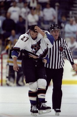 1 May 1998:  Referee Wayne Bonney escorts Craig Berube #27 of the Washington Capitals off the ice during the Capitals 4-0 Eastern Conference playoffs loss to the Boston Bruins at the Fleet Center in Boston, Massachusetts. Mandatory Credit: Doug Pensinger