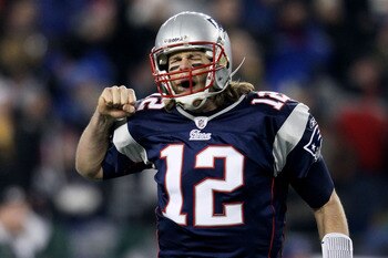 FOXBORO, MA - DECEMBER 19:  Quarterback Tom Brady #12 of the New England Patriots celebrates a touchdown scored by running back BenJarvus Green-Ellis #42 (not pictured) against the Green Bay Packers in the first quarter of the game at Gillette Stadium on