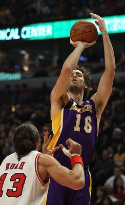 CHICAGO, IL - DECEMBER 10: Pau Gasol #16 of the Los Angeles Lakers puts up a shot over Joakim Noah #13 of the Chicago Bulls at the United Center on December 10, 2010 in Chicago, Illinois. The Bulls defeated the Lakers 88-84. NOTE TO USER: User expressly a