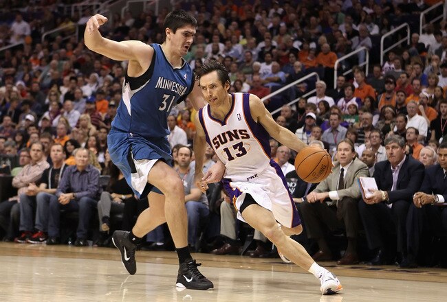 PHOENIX - DECEMBER 15:  Steve Nash #13 of the Phoenix Suns drives the ball past Darko Milicic #31 of the Minnesota Timberwolves during the NBA game at US Airways Center on December 15, 2010 in Phoenix, Arizona. The Suns defeated the Timberwolves 128-122.