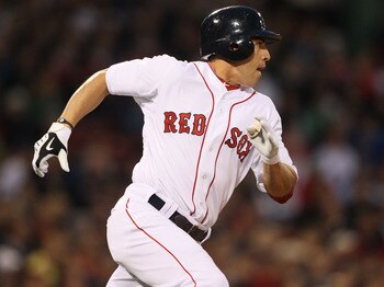 BOSTON - APRIL 06:  Jacoby Ellsbury #2 of the Boston Red Sox heads to first base in the first inning against the New York Yankees on April 6, 2010 at Fenway Park in Boston, Massachusetts.  (Photo by Elsa/Getty Images)