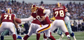 ARLINGTON, TX - DECEMBER 19:  Quarterback Rex Grossman #8 of the Washington Redskins during play against the Dallas Cowboys at Cowboys Stadium on December 19, 2010 in Arlington, Texas.  (Photo by Ronald Martinez/Getty Images)