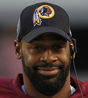 ARLINGTON, TX - DECEMBER 19:  Quarterback Donovan McNabb #5  of the Washington Redskins on the sidelines against play against the Dallas Cowboys at Cowboys Stadium on December 19, 2010 in Arlington, Texas.  (Photo by Ronald Martinez/Getty Images)