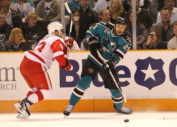 SAN JOSE, CA - MAY 8: Ryan Clowe #29 of the San Jose Sharks skates with the puck against Johan Franzen #93 of the Detroit Red Wings in Game Five of the Western Conference Semifinals during the 2010 NHL Stanley Cup Playoffs at HP Pavilion on May 8, 2010 in