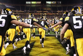 TEMPE, AZ - DECEMBER 28:  The Iowa Hawkeyes run out onto the field before the Insight Bowl against the Missouri Tigers at Sun Devil Stadium on December 28, 2010 in Tempe, Arizona.  The Hawkeyes defeated the Tigers 27-24.  (Photo by Christian Petersen/Gett