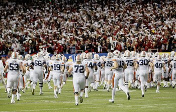 ATLANTA, GA - DECEMBER 04:  The Auburn Tigers huddle during pregame warmups before facing the South Carolina Gamecocks during the 2010 SEC Championship at Georgia Dome on December 4, 2010 in Atlanta, Georgia.  (Photo by Kevin C. Cox/Getty Images)
