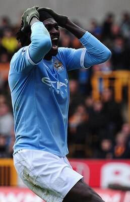 WOLVERHAMPTON, ENGLAND - OCTOBER 30:  Emmanuel Adebayor of Manchester City battles shows his frustrations after a wasted chance during the Barclays Premier League match between Wolverhampton Wanderers and Manchester City at Molineux on October 30, 2010 in
