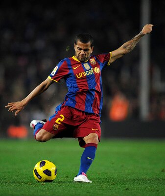 BARCELONA, SPAIN - DECEMBER 12:  Dani Alves of Barcelona shoots at goal during the La Liga match between Barcelona and Real Sociedad at Camp Nou Stadium on December 12, 2010 in Barcelona, Spain. Barcelona won 5-0.  (Photo by David Ramos/Getty Images)