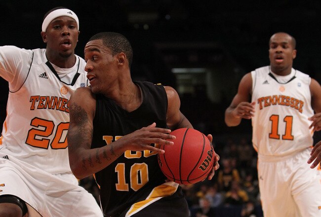 NEW YORK - NOVEMBER 24:  Darius Theus #10 of the Virginia Commonwealth Rams drives to the basket against the Tennessee Volunteers during their preseason NIT semifinal at Madison Square Garden on November 24, 2010 in New York City.  (Photo by Nick Laham/Ge