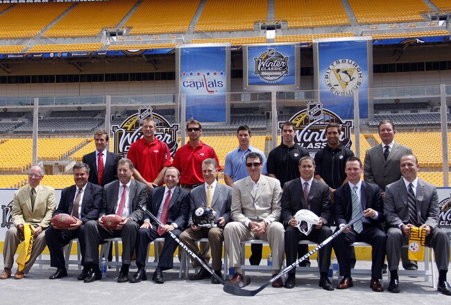 PITTSBURGH - JULY 27:  NHL Commissioner Gary Bettman, Steelers co-Owner and President Art Rooney II, and Penguins Chairman Mario Lemieux pose alongside other NHL personal and local County Officials for a group photo at the 2011 Bridgestone NHL Winter Clas