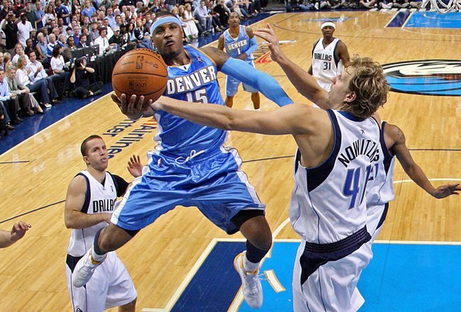 DALLAS - MAY 11:  Forward Carmelo Anthony #15 of the Denver Nuggets takes a shot against Dirk Nowtizki #41 of the Dallas Mavericks in Game Four of the Western Conference Semifinals during the 2009 NBA Playoffs at American Airlines Center on May 11, 2009 i