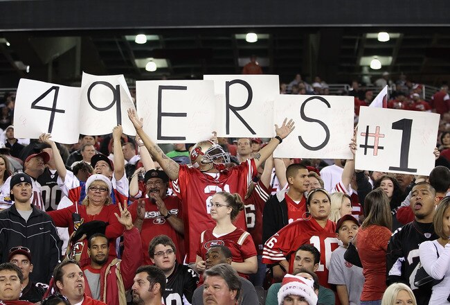 GLENDALE, AZ - NOVEMBER 29:  Fans of the San Francisco 49ers hold up signs and cheer during the NFL game against the Arizona Cardinals at the University of Phoenix Stadium on November 29, 2010 in Glendale, Arizona. The 49ers defeated the Cardinals 27-6.