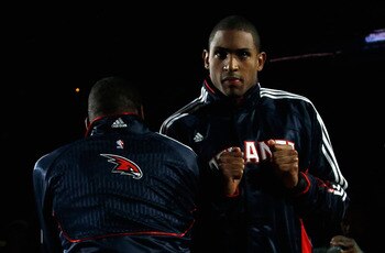 ATLANTA, GA - DECEMBER 11:  Josh Powell #12 and Al Horford #15 of the Atlanta Hawks against the Indiana Pacers at Philips Arena on December 11, 2010 in Atlanta, Georgia.  NOTE TO USER: User expressly acknowledges and agrees that, by downloading and/or usi