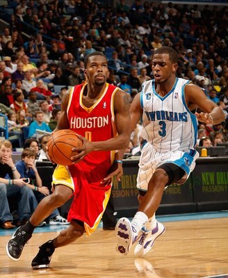 NEW ORLEANS - JANUARY 02:  Aaron Brooks #0 of the Houston Rockets drives the ball around Chris Paul #3 of the New Orleans Hornets at the New Orleans Arena on January 2, 2010 in New Orleans, Louisiana.  NOTE TO USER: User expressly acknowledges and agrees