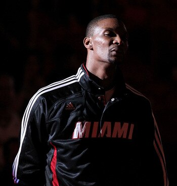 MIAMI, FL - DECEMBER 04:  Chris Bosh #1 of the Miami Heat looks on  during pregame against the Atlanta Hawks at American Airlines Arena on December 4, 2010 in Miami, Florida. NOTE TO USER: User expressly acknowledges and agrees that, by downloading and/or