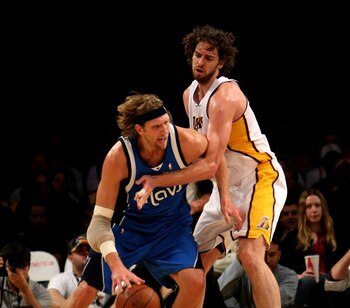 LOS ANGELES, CA - JANUARY 03: Dirk Nowitzki #41 of the Dallas Mavericks driveas against Pau Gasol #16 of the Los Angeles Lakers on January 3, 2010 at Staples Center in Los Angeles, California. NOTE TO USER: User expressly acknowledges and agrees that, by