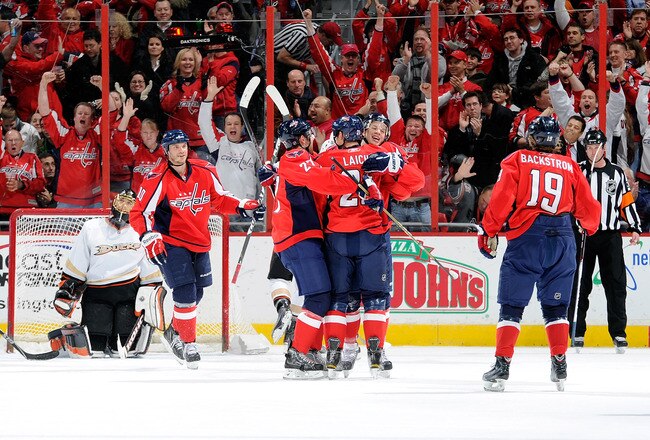 WASHINGTON, DC - DECEMBER 15:  Brooks Laich #21 of the Washington Capitals celebrates with teammates after scoring in the first period against the Anaheim Ducks at the Verizon Center on December 15, 2010 in Washington, DC.  (Photo by Greg Fiume/Getty Imag