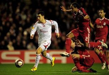 LIVERPOOL, ENGLAND - MARCH 18:  Eden Hazard of Lille breaks clear of the challenge of Glen Johnson of Liverpool during the UEFA Europa League Round of 16, second leg match at Anfield on March 18, 2010 in Liverpool, England.  (Photo by Shaun Botterill/Gett