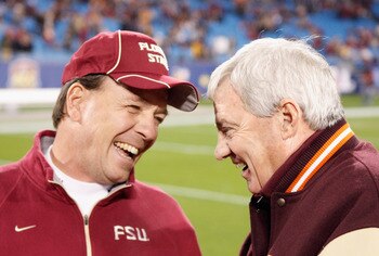 CHARLOTTE, NC - DECEMBER 04:  Head coach Jimbo Fisher of the Florida State Seminoles talks with head coach Frank Beamer of the Virginia Tech Hokies during their game at Bank of America Stadium on December 4, 2010 in Charlotte, North Carolina.  (Photo by S