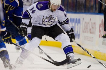 ST. LOUIS, MO - DECEMBER 16: Justin Williams #14 of the Los Angeles Kings looks to control the puck against the St. Louis Blues at the Scottrade Center on December 16, 2010 in St. Louis, Missouri.  (Photo by Dilip Vishwanat/Getty Images)