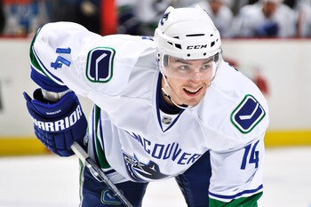 PITTSBURGH - NOVEMBER 17:  Alexandre Burrows #14 of the Vancouver Canucks waits for a face off against the Pittsburgh Penguins on November 17, 2010 at Consol Energy Center in Pittsburgh, Pennsylvania.  (Photo by Jamie Sabau/Getty Images)