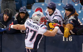 ORCHARD PARK, NY - DECEMBER 26: Rob Gronkowski #87 of the New England Patriots celebrates with fans after playing the Buffalo Bills at Ralph Wilson Stadium on December 26, 2010 in Orchard Park, New York. Gronkowski is a Buffalo native and had two touchdow