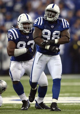 INDIANAPOLIS - NOVEMBER 04:  Robert Mathis #98 and Dwight Freeney #93 of the Indianapolis Colts react after Mathis sacked Tom Brady #12 of the New England Patriots in the third quarter of their game on November 4, 2007 at the RCA Dome in Indianapolis, Ind
