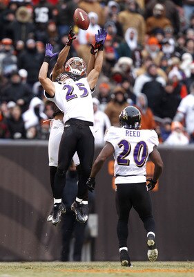 CLEVELAND - DECEMBER 26:  Safety Chris Carr #25 of the Baltimore Ravens jumps for the ball as safety Ed Reed #20 looks on with wide receiver Chansi Stuckey #83 of the Cleveland Browns at Cleveland Browns Stadium on December 26, 2010 in Cleveland, Ohio.  (