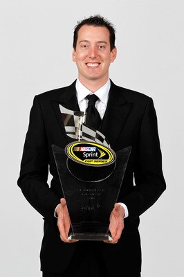 LAS VEGAS, NV - DECEMBER 03:  NASCAR driver Kyle Busch poses with his eighth place trophy during the NASCAR Sprint Cup Series awards banquet at the Wynn Las Vegas Hotel on December 3, 2010 in Las Vegas, Nevada.  (Photo by Todd Warshaw/Getty Images for NAS