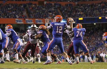GAINESVILLE, FL - NOVEMBER 13:  John Brantley #12 of the Florida Gators passes during a game against the South Carolina Gamecocks at Ben Hill Griffin Stadium on November 13, 2010 in Gainesville, Florida.  (Photo by Mike Ehrmann/Getty Images)