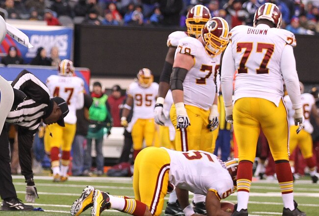 EAST RUTHERFORD, NJ - DECEMBER 05:  Justin Tuck #91 of the New York Giants celebrates with Osi Umenyiora #72 after Tuck sacked Donovan McNabb #5 of the Washington Redskins who fumbled and loset the ball during their game on December 5, 2010 at The New Mea