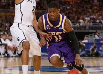ST. LOUIS, MO. - MARCH 26: Kwadzo Ahelegbe #11 of the Northern Iowa Panthers drives past Chris Allen #3 of the Michigan State Spartans during the midwest regional semifinal of the 2010 NCAA men's basketball tournament at the Edward Jones Dome on March 26,