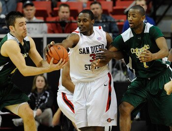 LAS VEGAS - MARCH 11:  Tyrone Shelley #3 of the San Diego State Aztecs fights Travis Busch #10 and Travis Franklin #1 of the Colorado State Rams for a loose ball during a quarterfinal game of the Conoco Mountain West Conference Basketball tournament at th