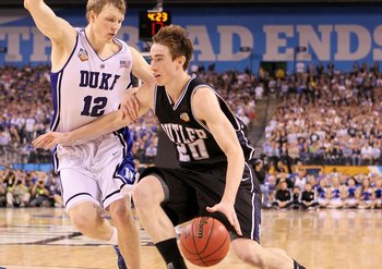 INDIANAPOLIS - APRIL 05:  Gordon Hayward #20 of the Butler Bulldogs drives against Kyle Singler #12 of the Duke Blue Devils during the 2010 NCAA Division I Men's Basketball National Championship game at Lucas Oil Stadium on April 5, 2010 in Indianapolis,
