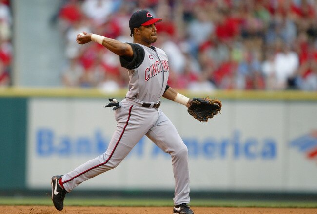 ST. LOUIS - JULY 6:  Infielder Barry Larkin #11 of the Cincinnati Reds throws the ball against the St. Louis Cardinals during the game at Busch Stadium on July 6, 2004 in St. Louis, Missouri. The Reds won 5-3.  (Photo by Elsa/Getty Images)