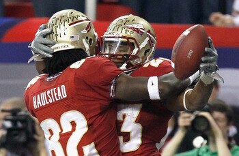 ATLANTA, GA - DECEMBER 31:  Chris Thompson #23 of the Florida State Seminoles celebrates scoring a touchdown against the South Carolina Gamecocks with Willie Haulstead #82 during the 2010 Chick-fil-A Bowl at Georgia Dome on December 31, 2010 in Atlanta, G