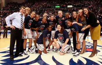 HARTFORD, CT - DECEMBER 21:  Coach Geno Auriemma of Connecticut and his team pose for a picture after defeating Florida State on December 21, 2010 in Hartford, Connecticut. Connecticut set a record with 89 straight wins without a defeat. Connecticut set a