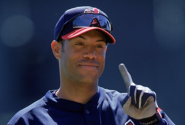 12 Mar 2000: Roberto Alomar #12 of the Cleveland Indians signals number one as he stands on the field during a Spring Training Game against the Atlanta Braves at Disney Wide World of Sports in Orlando, Florida. Mandatory Credit: Andy Lyons  /Allsport