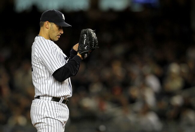 NEW YORK - OCTOBER 18:  Andy Pettitte #46 of the New York Yankees gets set to throw a pitch against the Texas Rangers in Game Three of the ALCS during the 2010 MLB Playoffs at Yankee Stadium on October 18, 2010 in New York, New York.  (Photo by Nick Laham