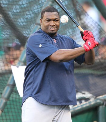 SEATTLE - SEPTEMBER 13:  David Ortiz #34 of the Boston Red Sox hits grounders to teammates taking infield practice between his turns in the cage for batting practice prior to the game against the Seattle Mariners at Safeco Field on September 13, 2010 in S