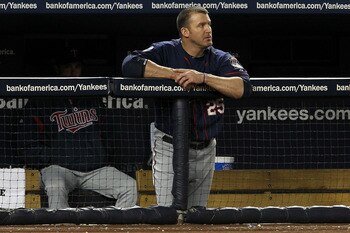 NEW YORK - OCTOBER 09:  Jim Thome #25 of the Minnesota Twins looks on dejected from the dugout against the New York Yankees  during Game Three of the ALDS part of the 2010 MLB Playoffs at Yankee Stadium on October 9, 2010 in the Bronx borough of New York