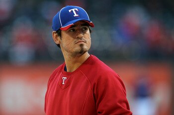 ARLINGTON, TX - OCTOBER 15:  Jorge Cantu #8 of the Texas Rangers looks on during batting practice against the New York Yankees in Game One of the ALCS during the 2010 MLB Playoffs at Rangers Ballpark in Arlington on October 15, 2010 in Arlington, Texas.