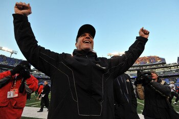 BALTIMORE, MD - DECEMBER 19:  Head coach John Harbaugh of the Baltimore Ravens celebrates the Ravens victory as he walks off the field after the game against the New Orleans Saints  at M&T Bank Stadium on December 19, 2010 in Baltimore, Maryland. The Rave