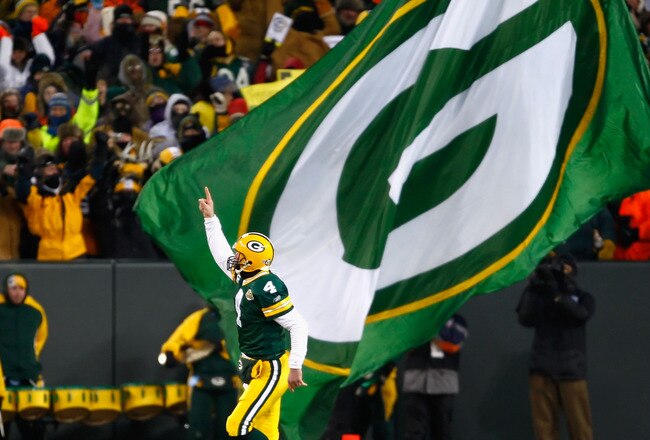 GREEN BAY, WI - JANUARY 20:  Quarterback Brett Favre #4 of the Green Bay Packers celebrates after throwing a 90 yard touchdown reception against the New York Giants during the NFC championship game on January 20, 2008 at Lambeau Field in Green Bay, Wiscon
