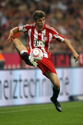 MUNICH, GERMANY - AUGUST 20:  Thomas Mueller of Bayern controls the ball during the Bundesliga match between FC Bayern Muenchen and VfL Wolfsburg at Allianz Arena on August 20, 2010 in Munich, Germany.  (Photo by Clive Brunskill/Getty Images)