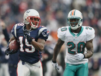 FOXBORO, MA - JANUARY 02:  Brandon Tate #19 of the New England Patriots carries the ball as Reshad Jones #20 of the Miami Dolphins chases after him on January 2, 2011 at Gillette Stadium in Foxboro, Massachusetts.  (Photo by Elsa/Getty Images)